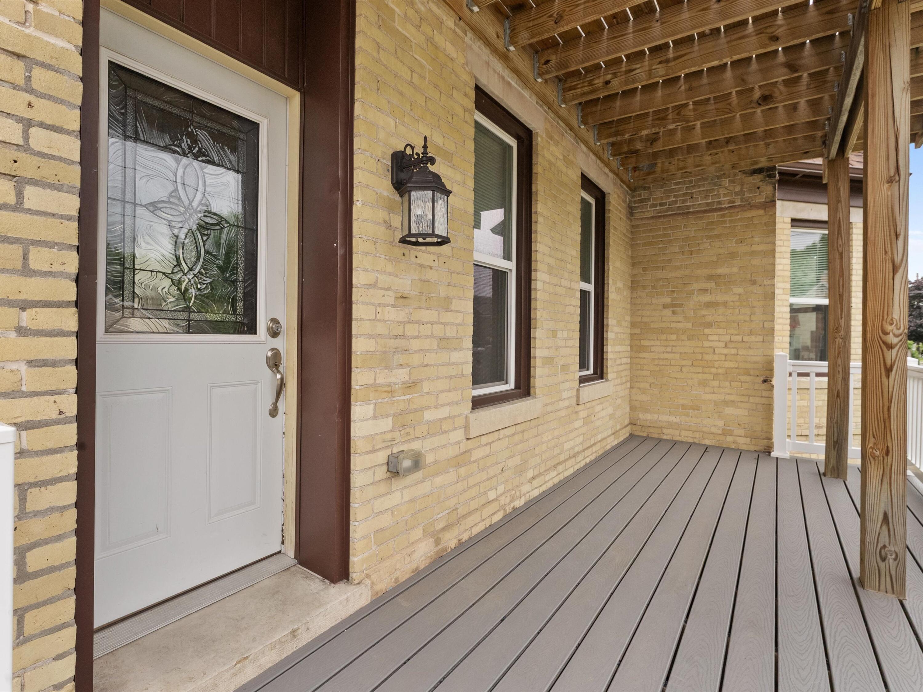 818 North 6th Street Manitowoc, WI 54220 - Photo 30 of 35 Covered Front Deck