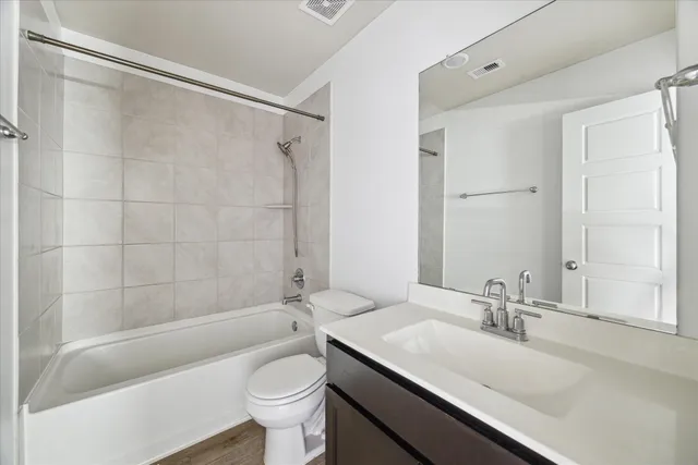 a bathroom with a sink a toilet and a bathtub