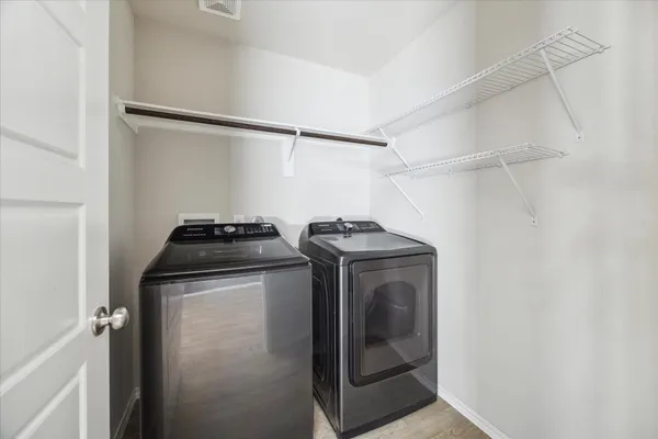 a utility room with dryer and washer