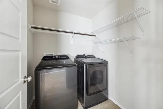 a utility room with dryer and washer