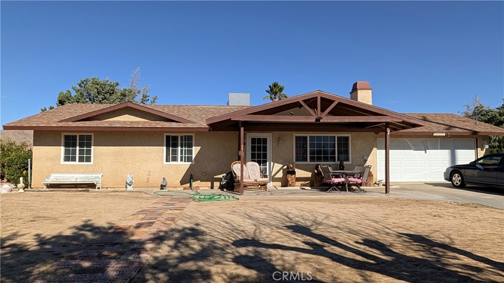 a front view of a house with patio