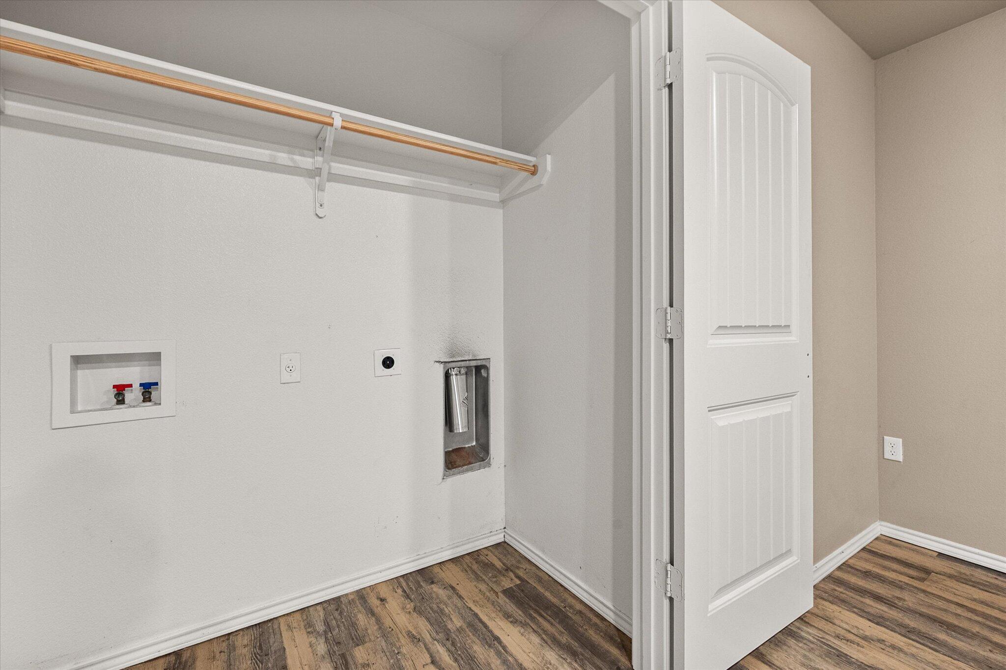 7412 5th Street, Unit 1 Lubbock, TX 79416 - Photo 10 of 16 a view of a hallway with wooden floor and entryway