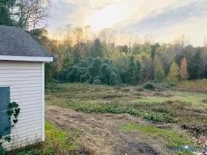 a white house with red and white umbrella