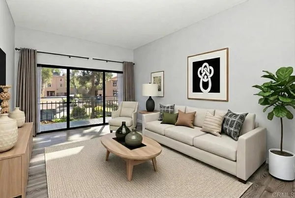 a living room with furniture and a large window with outer view