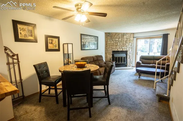a view of a livingroom with furniture and a fireplace
