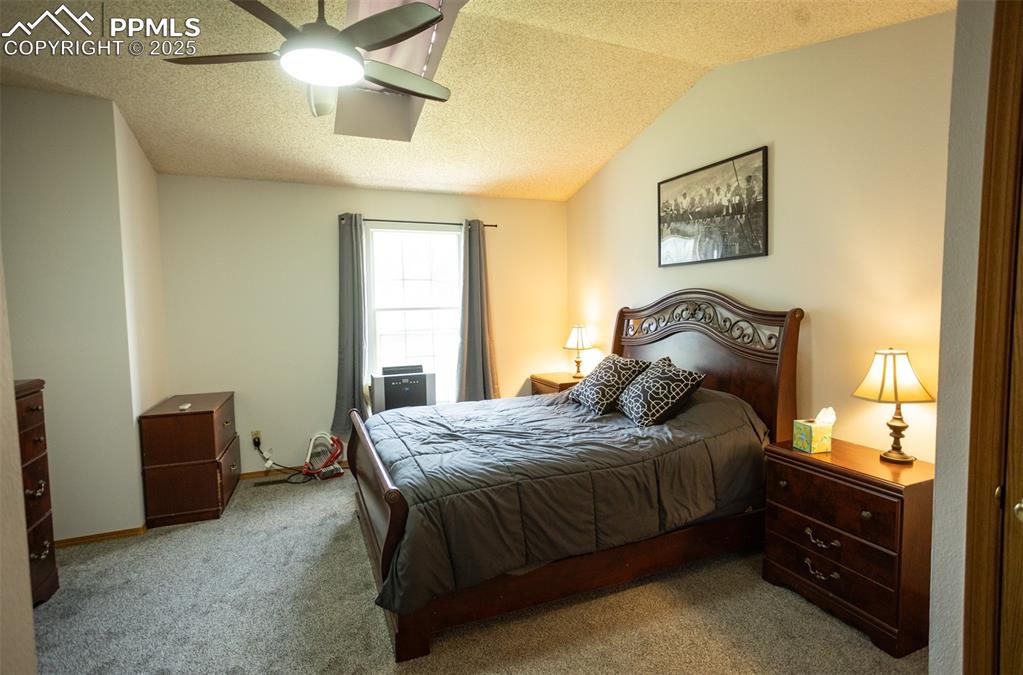 3515 Queen Anne Way Colorado Springs, CO 80917 - Photo 17 of 33 a bedroom with a bed and a window