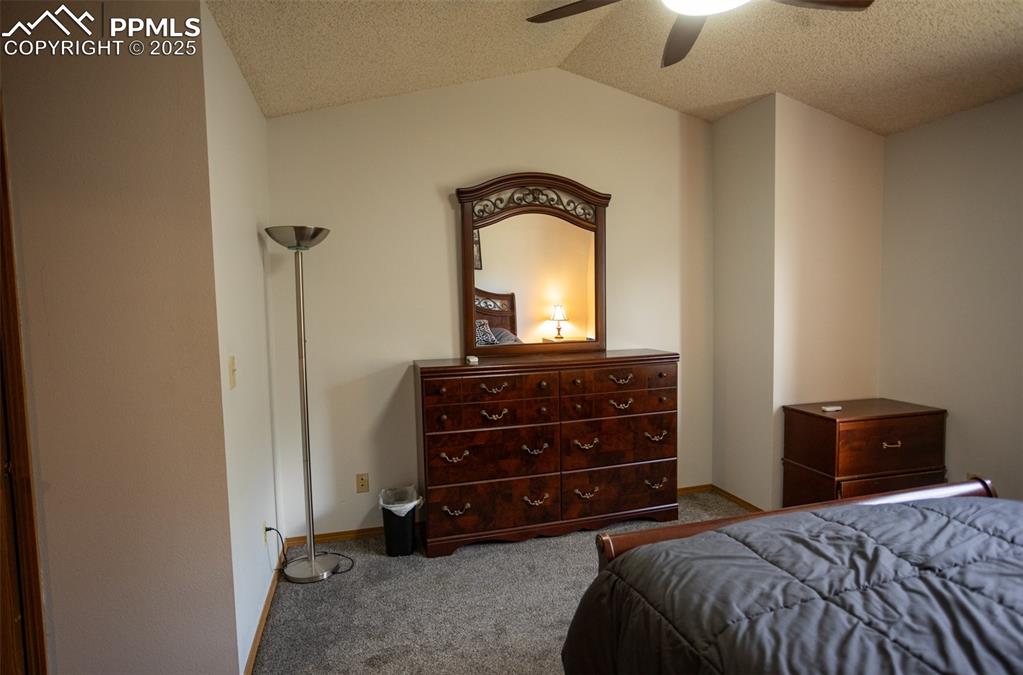 3515 Queen Anne Way Colorado Springs, CO 80917 - Photo 18 of 33 a bedroom with a bed and a dresser