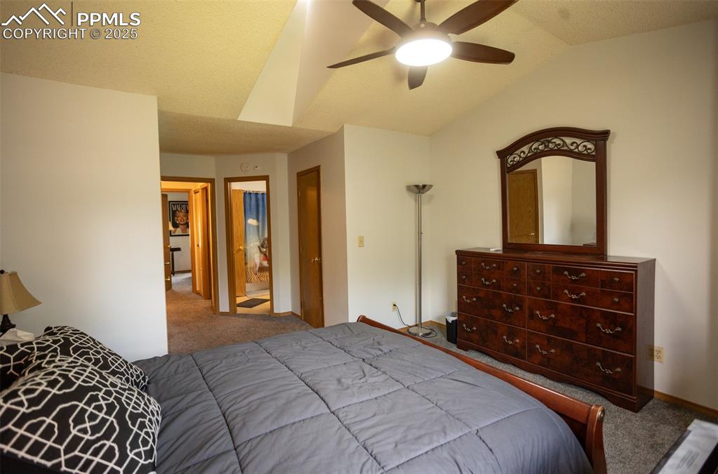 3515 Queen Anne Way Colorado Springs, CO 80917 - Photo 20 of 33 a bedroom with a bed and a dresser