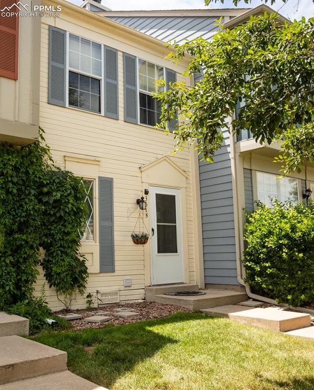 3515 Queen Anne Way Colorado Springs, CO 80917 - Photo 2 of 33 a view of a house with backyard and garden