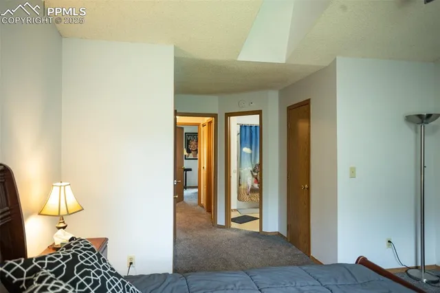 a bedroom with a bed and a table