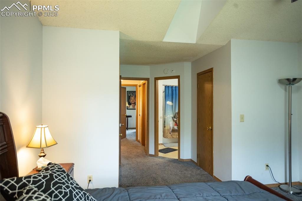 3515 Queen Anne Way Colorado Springs, CO 80917 - Photo 22 of 33 a bedroom with a bed and a table