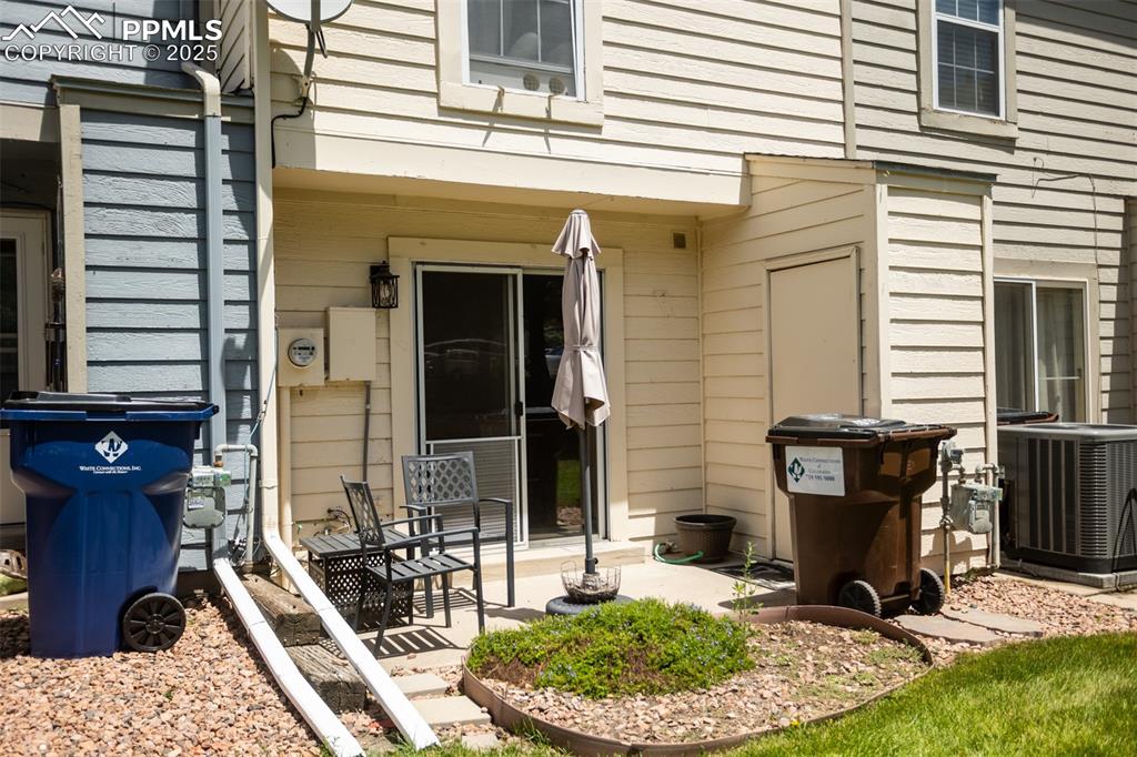 3515 Queen Anne Way Colorado Springs, CO 80917 - Photo 29 of 33 a view of a house with backyard porch and sitting area