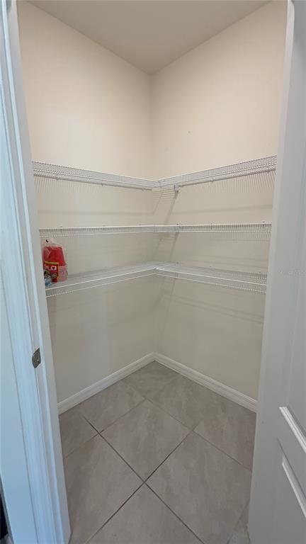 611 Autumn Stream Drive Auburndale, FL 33823 - Photo 11 of 30 a view of a room with racks on the wall