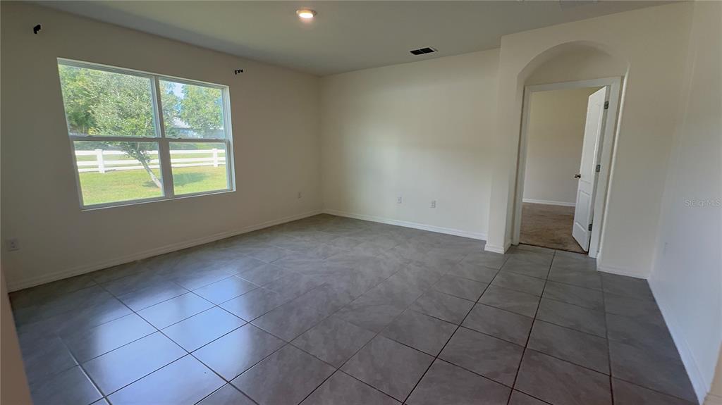 611 Autumn Stream Drive Auburndale, FL 33823 - Photo 13 of 30 an empty room with windows