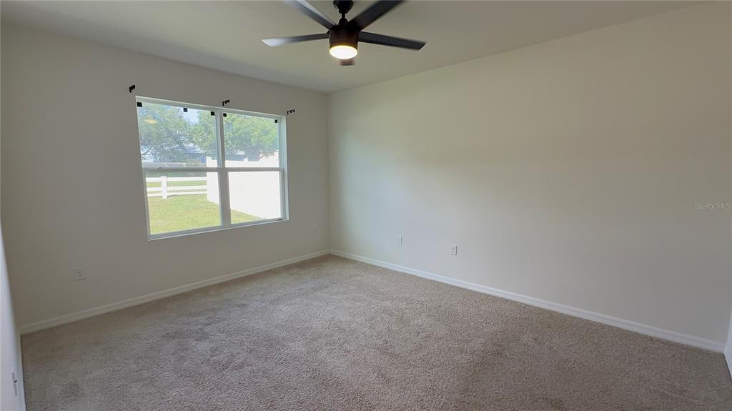 611 Autumn Stream Drive Auburndale, FL 33823 - Photo 16 of 30 an empty room with a window