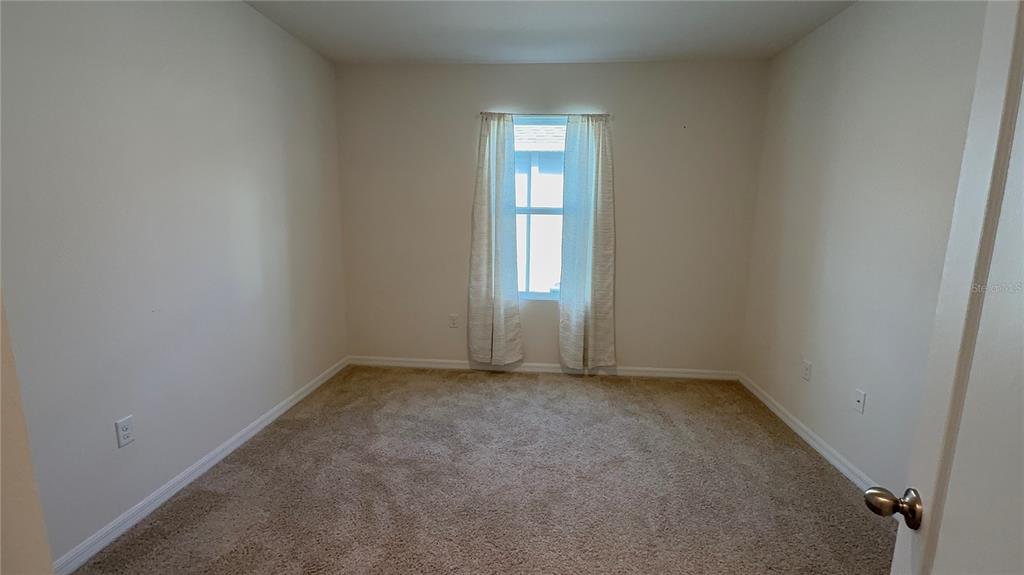 611 Autumn Stream Drive Auburndale, FL 33823 - Photo 17 of 30 an empty room with windows