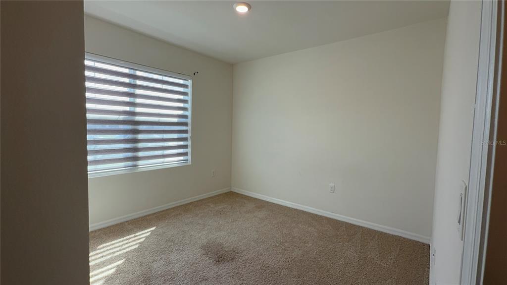 611 Autumn Stream Drive Auburndale, FL 33823 - Photo 19 of 30 an empty room with a window