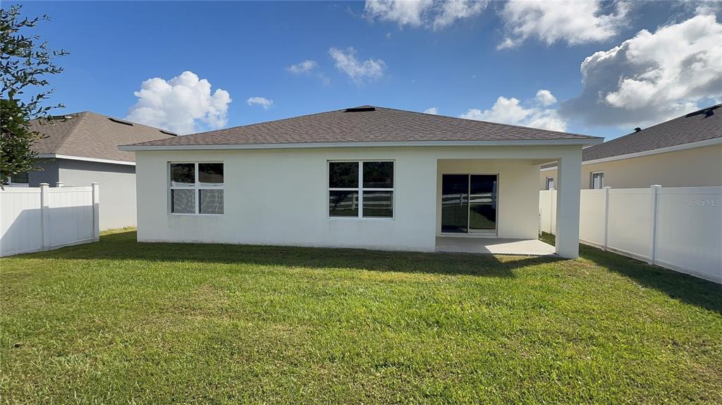 611 Autumn Stream Drive Auburndale, FL 33823 - Photo 25 of 30 a view of a backyard of the house