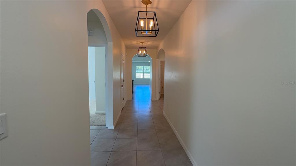 611 Autumn Stream Drive Auburndale, FL 33823 - Photo 3 of 30 a view of a hallway