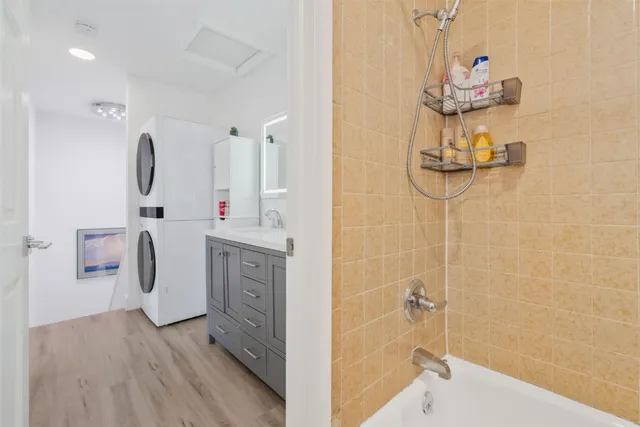 a bathroom with a sink vanity and mirror