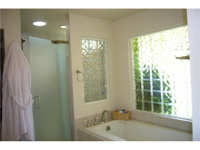 2146 Gum Tree Lane Fallbrook, CA 92028 - Photo 9 of 23 Glass block& frosted glass. Master Bath with large shower, dual sinks with mirrored medicine cabinets, decorator tiles and separate toilet room.