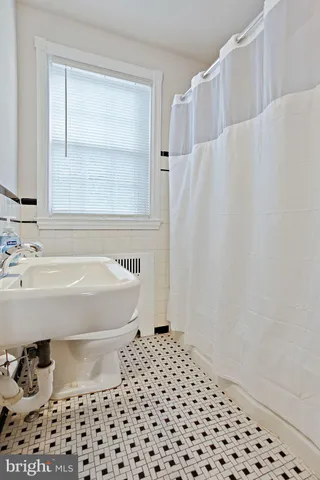 a bathroom with a bathtub and a sink