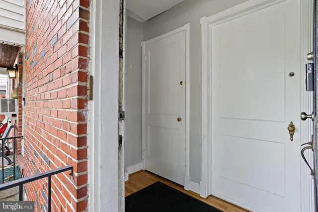 a view of front door and porch with seating space