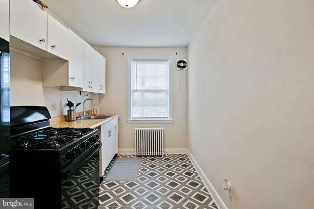 a kitchen with a stove and a refrigerator