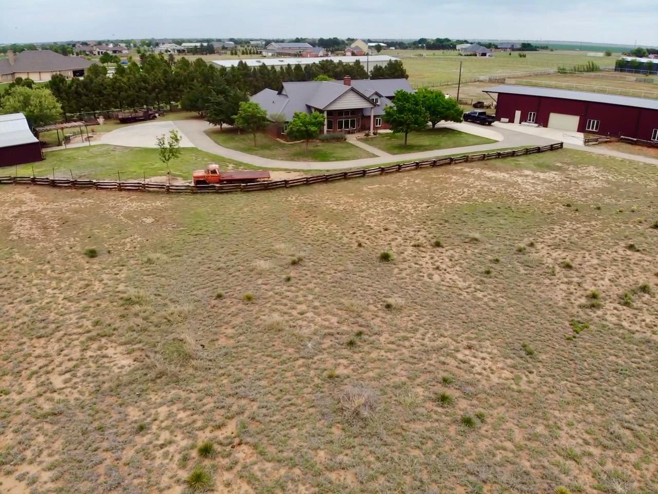 9002 Woodrow Road Wolfforth, TX 79382 - Photo 2 of 48 a view of a lake with outdoor space