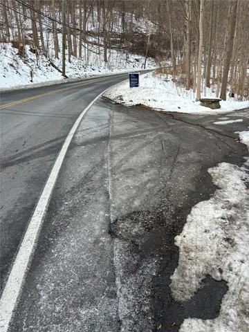 a view of a road with a snow on the road