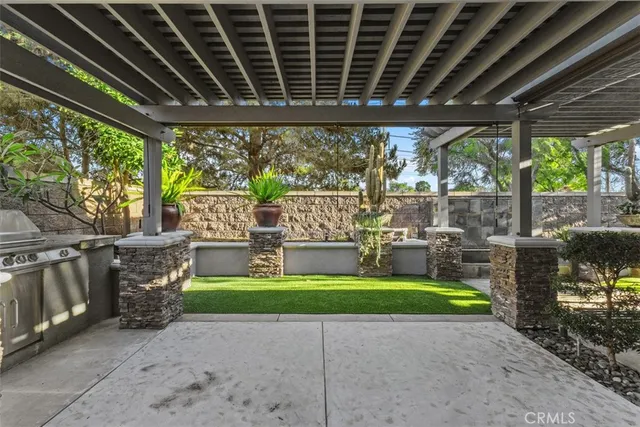 a building outdoor space with stove and garden view