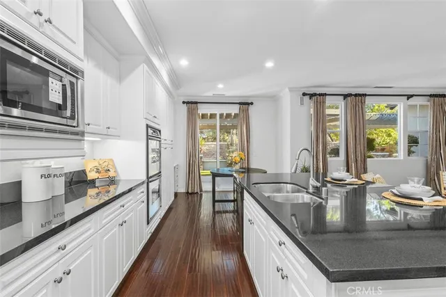 a large kitchen with granite countertop a lot of counter space