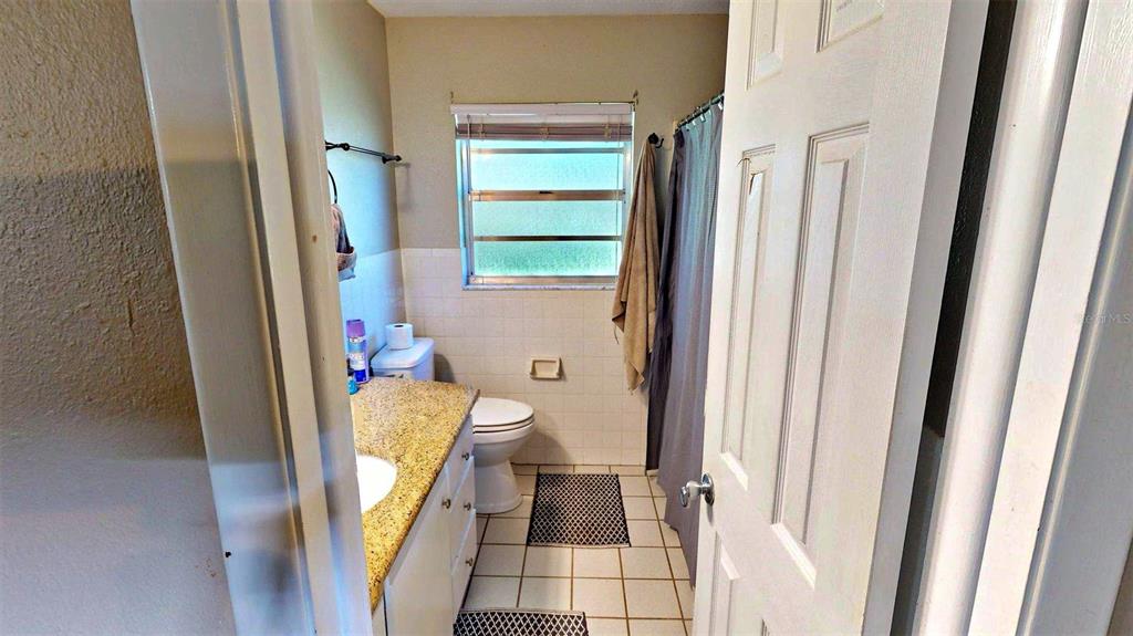 635 Bost Road Wauchula, FL 33873 - Photo 12 of 39 a bathroom with a toilet and a shower