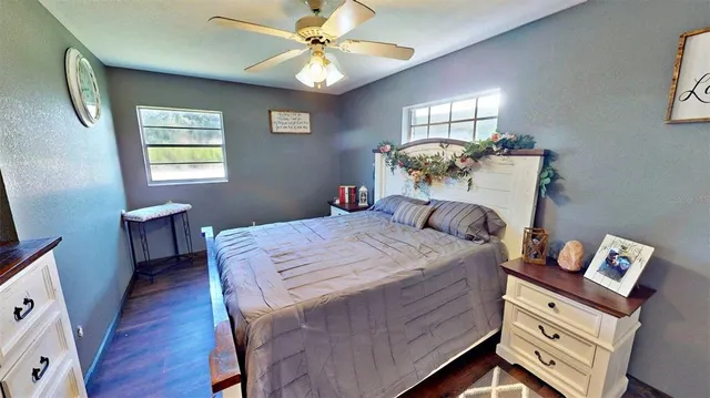 a bed room with a bed and a chandelier