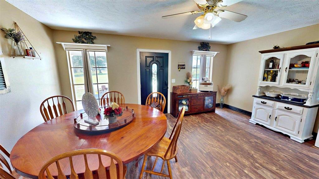 635 Bost Road Wauchula, FL 33873 - Photo 19 of 39 a living room with furniture and wooden floor