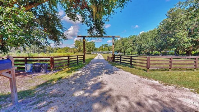 a view of park with wooden fence