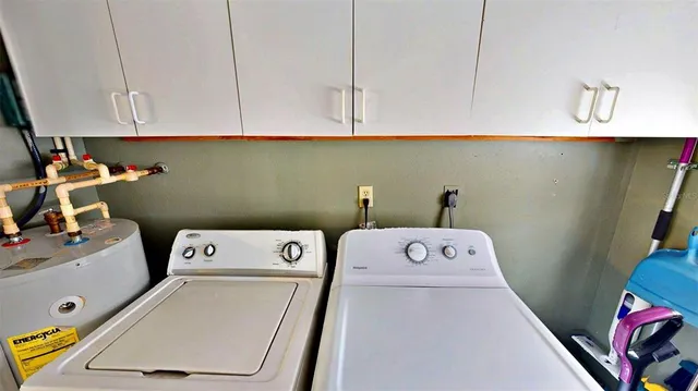a utility room with dryer and washer