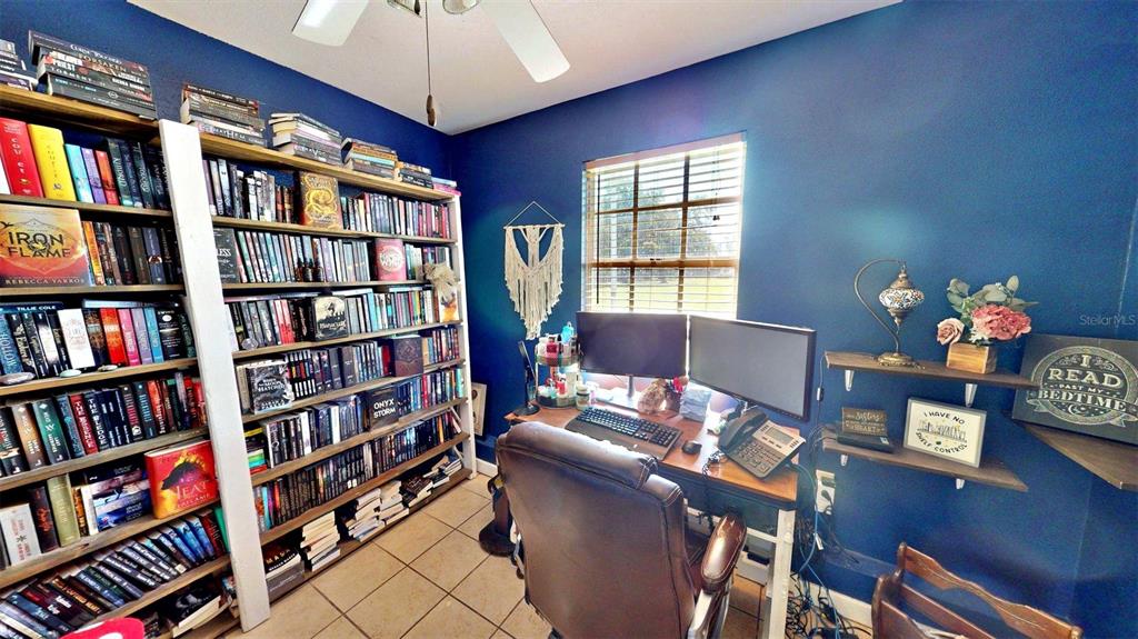 635 Bost Road Wauchula, FL 33873 - Photo 26 of 39 a work room with furniture and a book shelf