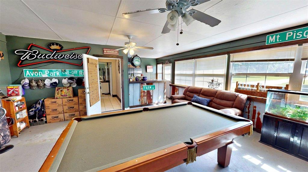 635 Bost Road Wauchula, FL 33873 - Photo 32 of 39 a room with gym equipment and a large window