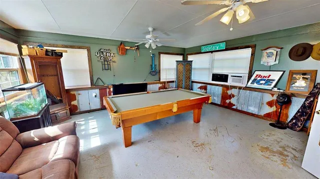 a outdoor living space with furniture and a flat screen tv
