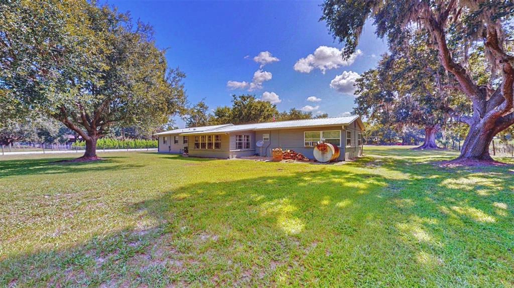 635 Bost Road Wauchula, FL 33873 - Photo 35 of 39 a view of a house with a yard