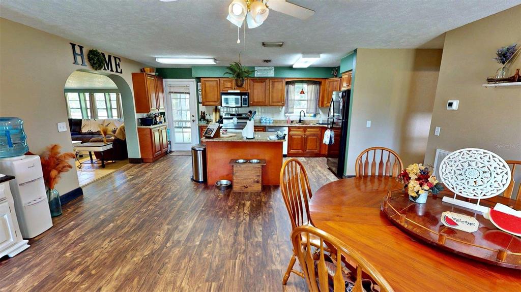 635 Bost Road Wauchula, FL 33873 - Photo 8 of 39 a dining room with wooden floor table and chairs
