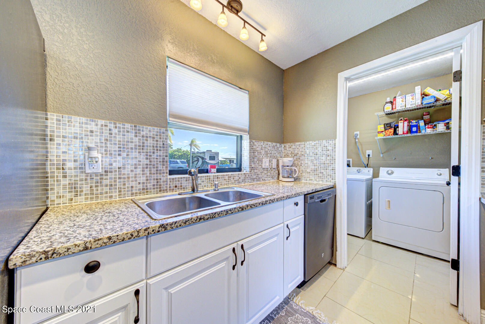 826 Mallard Road Cocoa, FL 32926 - Photo 8 of 21 kitchen & laundry room