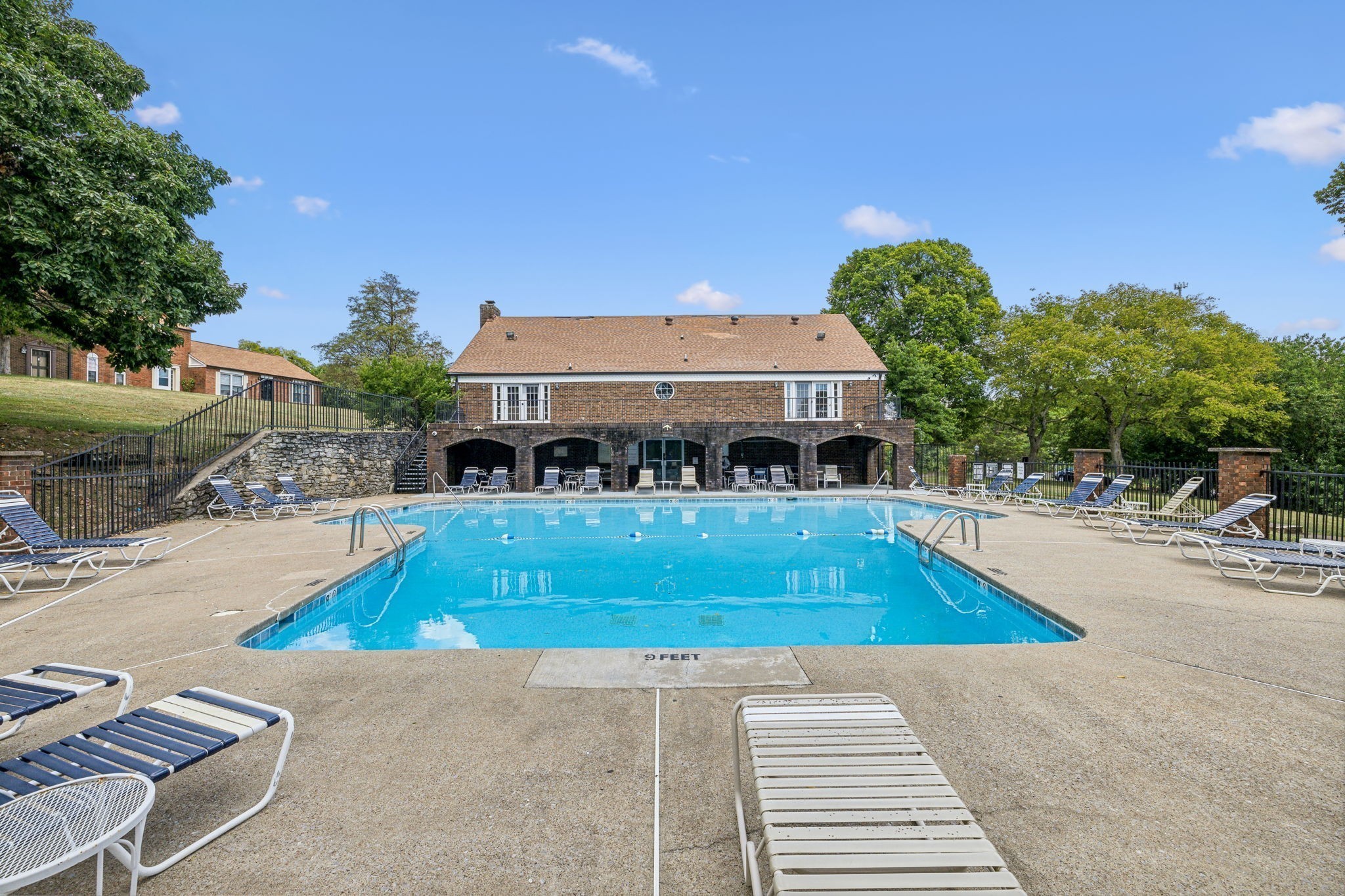 367 Huntington Ridge Drive Nashville, TN 37211 - Photo 27 of 28 a view of a swimming pool with lawn chairs and plants