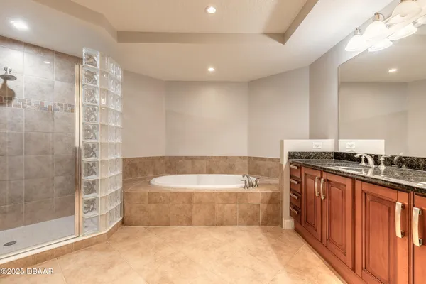 a bathroom with a shower and a sink