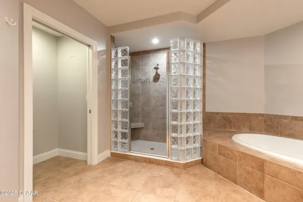 a view of a bathroom with a glass door and shower