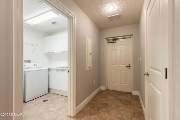 a bathroom with a granite countertop toilet sink and mirror