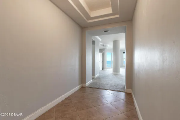 a view of an empty room and window