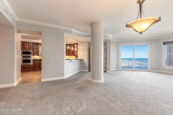 a view of a balcony with floor to ceiling windows with wooden floor