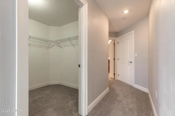 a view of a room with racks on the wall